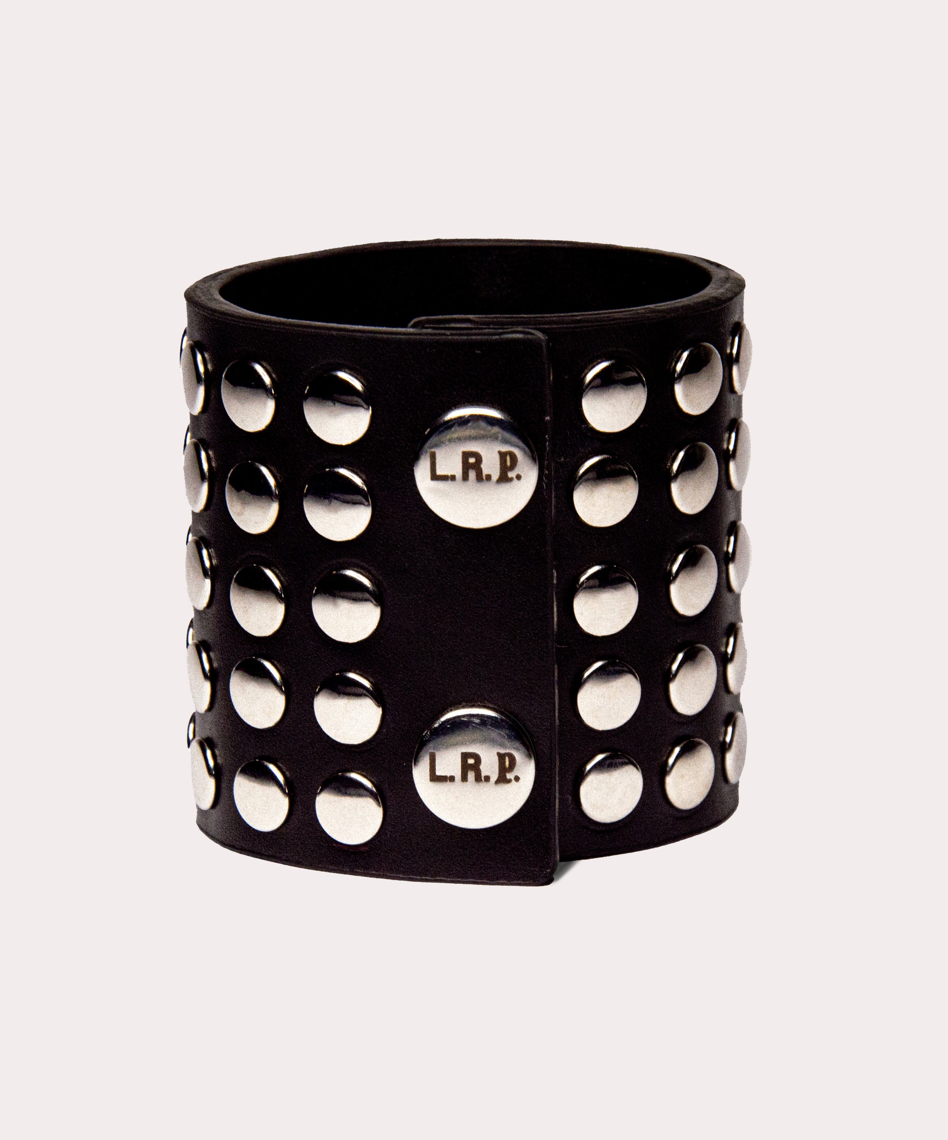 Black studded cuff with 'L.R.P.' branding on a light gray background
