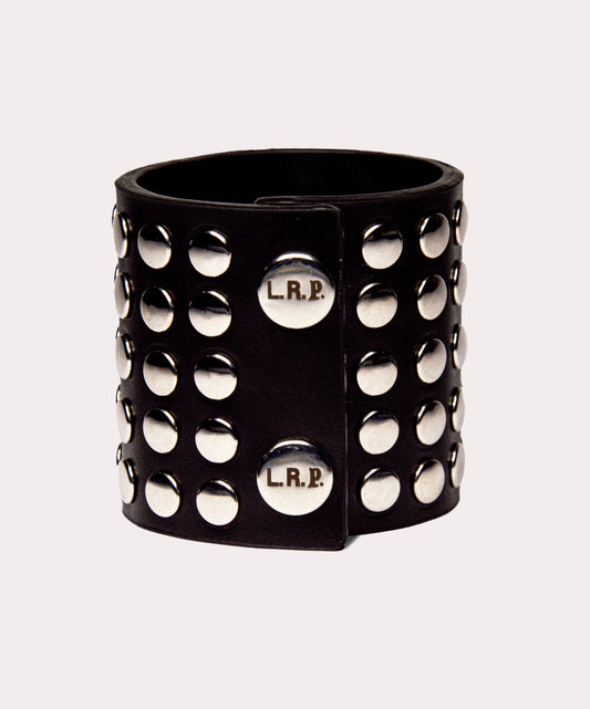 Black studded cuff with 'L.R.P.' branding on a light gray background